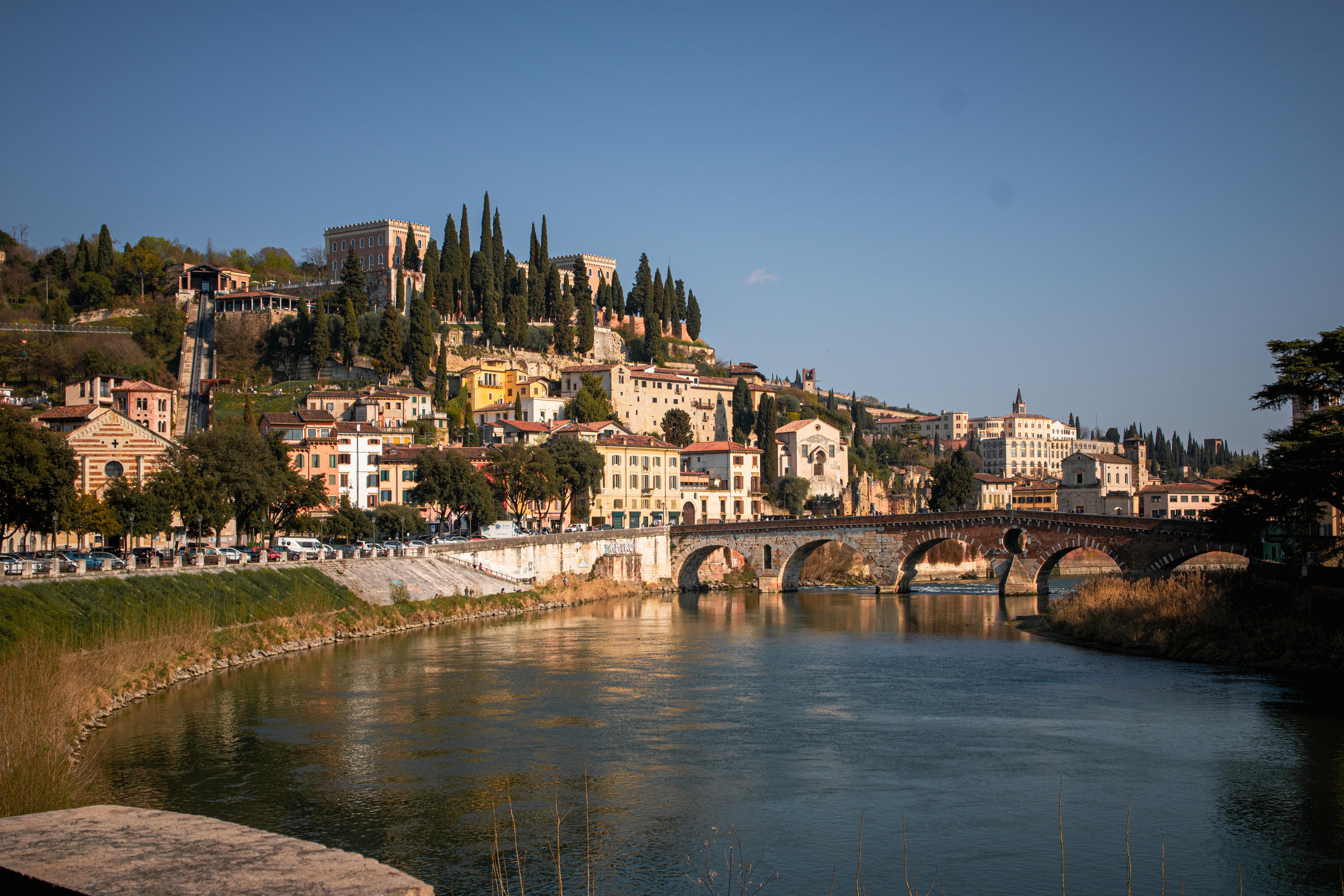 Verona — one of the most beautiful cities in Italy. No bus from Milan needed: take the train (from about €13 per person) and, on the way back, stop at Lake Garda.